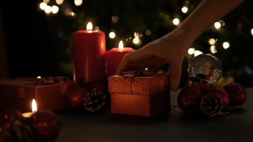 Holiday Gifts and Candles in Christmas Setting