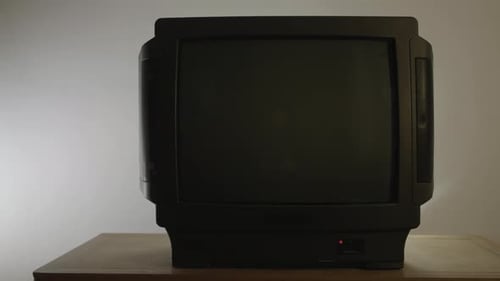 Vintage Black Television on a Wooden Dresser