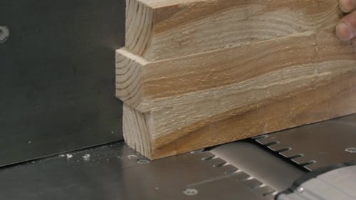 Man Using a Table Saw To Cut Wood, Grinding On Modern Furniture Factory
