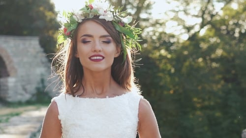 Woman in White Dress and Flower Crown Smiling