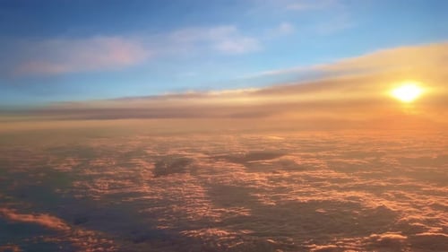 Aerial View of Amazing Sunset Over Floating Clouds