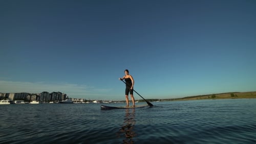 Beautiful Woman On Stand Up Paddle Board