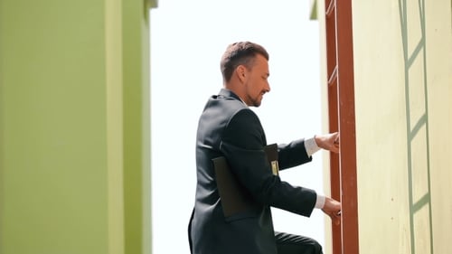 The Foreman Climb Up The Stairs At The Building