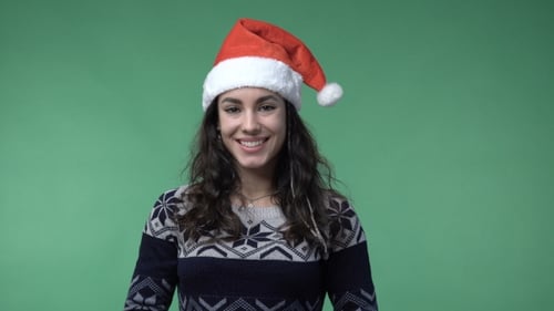 Festive Woman Wearing Christmas Hat Smiling