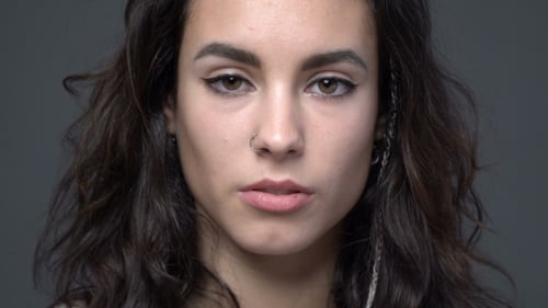 Portrait of a Young Woman with Eyeliner and Piercing