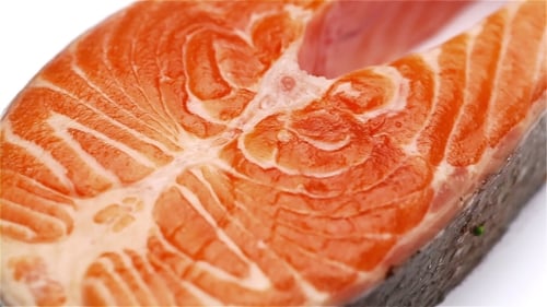 Close-up of Salmon Steak Slice on White