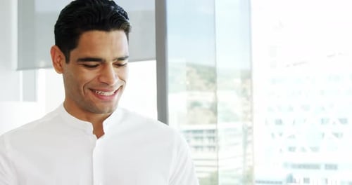 Businessman using digital tablet in a modern office 4k