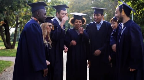 Graduates Celebrating Together Outdoors in Park
