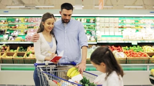 Family With Food In Shopping Cart At Grocery Store 7