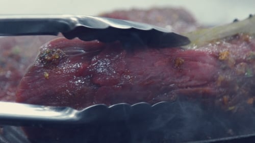 A Piece Of Meat Overturn a Special Shovel. Cooking Roast Beef.
