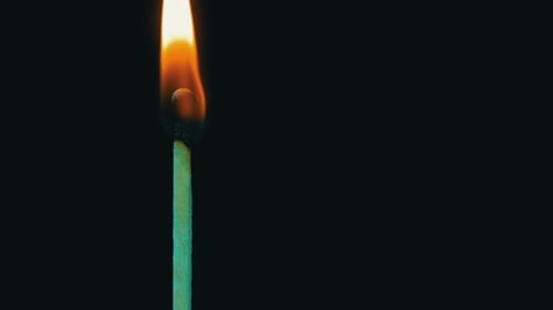 Burning Matchstick with Orange and Yellow Flames
