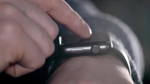 Finger Scrolling on Smart Watch in Close Up