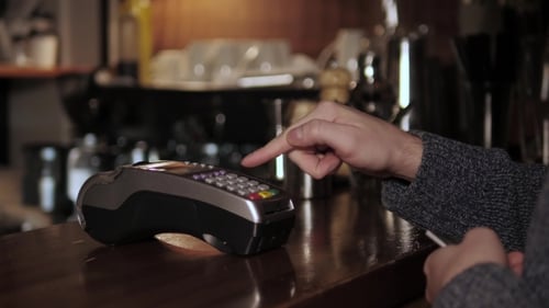 Hands With Credit Card Reader At Modern Cafe