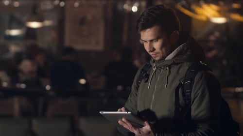 Handsome Young Man With Tablet Pc Navigating In The Night Streets