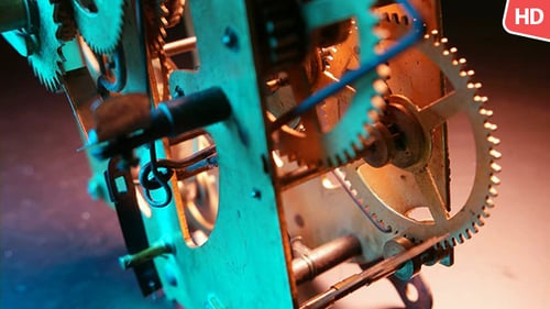 Clock Gears Spinning in Blue and Orange Light