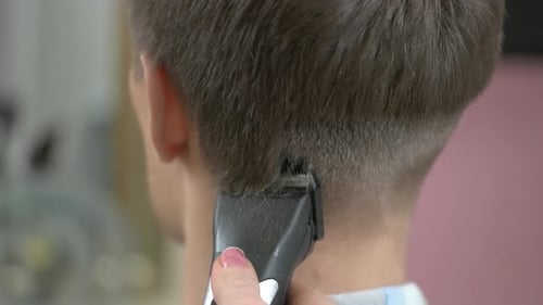 Boy Getting Haircut at Barbershop, Close Up
