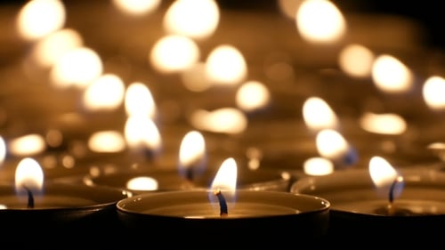 Glowing Candles Flickering in the Dark