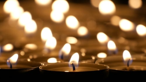 Flickering Tea Light Candles Glowing in the Dark