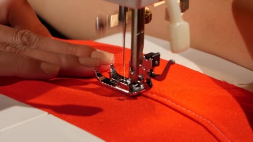 Stitch On Red Fabric.