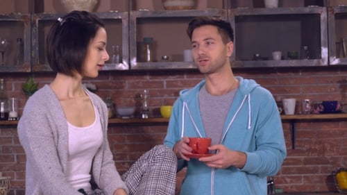 Young Couple Talking and Drinking Coffee at Home