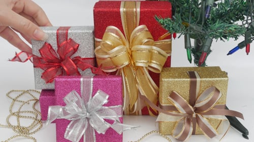 Sparkling Christmas Gifts Under Lit Tree