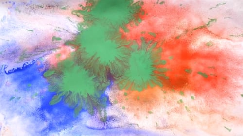 Colored Paint Splashes On White Wet Paper