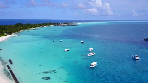 Drone aerial panorama of tropical island beach by water and sand background