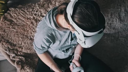 Woman Wearing VR Headset on Couch