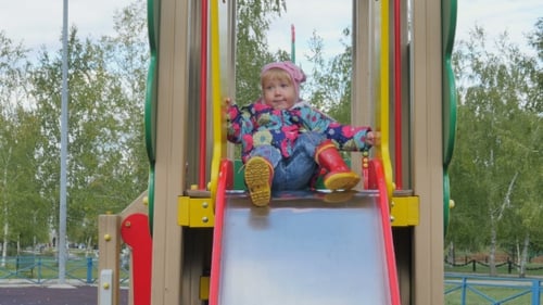 Little Girl Plays On The Playground