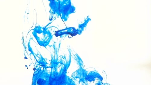 Blue Ink Swirling Abstractly in Clear Water