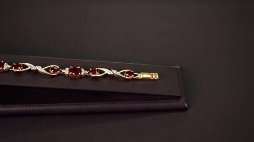 Jewelry, Precious Jewelry Bracelets Gold Chain On Hand With Rubies On a Stand Of The Store, Precious