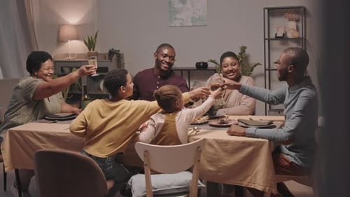 Family Celebratory Toast at Dinner Table