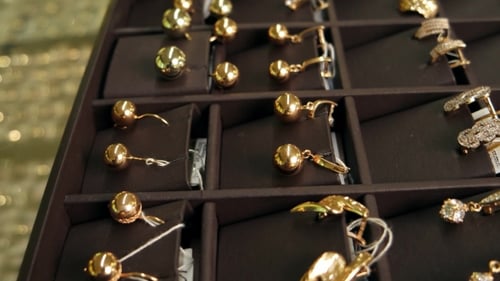 Gold Jewelry, A Lot Of Gold Earrings In The Window Slider Shot, Exposed For Sale, Jewellery On Store