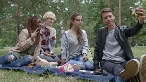 Friends Enjoying a Picnic and Taking Selfies