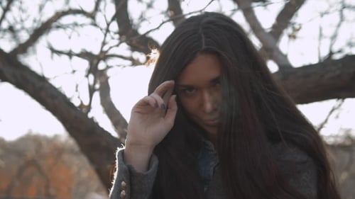 Outdoor Sensual Portrait Of Young Beautiful Stylish Woman With Long Dark Hair And Sexy Lips Posing