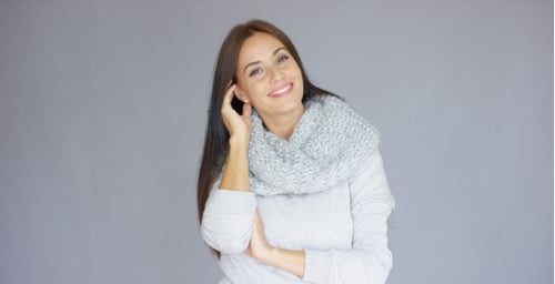 Woman Smiling in Light Gray Sweater and Scarf