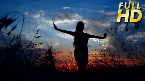Silhouette Woman Dancing at Sunset in Nature