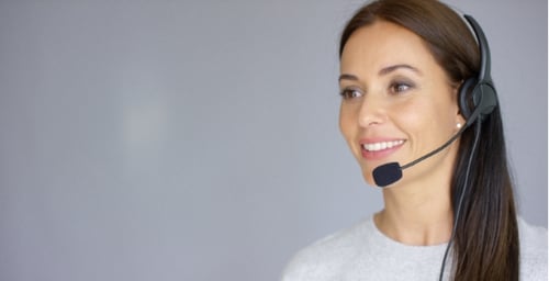 Beautiful And Positive Female Call Center Agent At Work