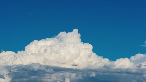 Dramatic Cumulonimbus Clouds Forming On Hot Summer Day With Blue Sky
