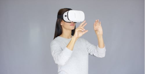 Woman Using Virtual Reality Headset Indoors