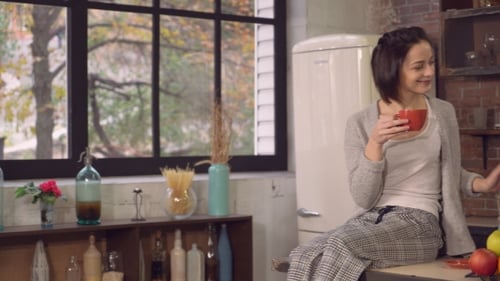 Young Couple Talking in Bright Kitchen
