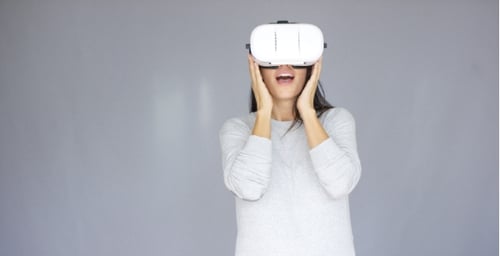 Woman Using Virtual Reality Headset in Studio
