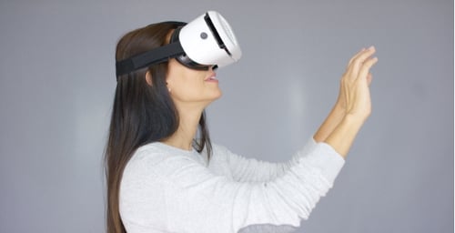 Woman Using Virtual Reality Headset in Studio