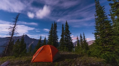 Scenic Nighttime Camping with Time-Lapse Clouds