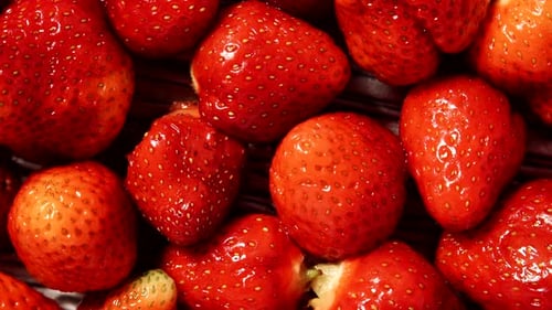 Frische Erdbeerfrüchte als Lebensmittel-Hintergrund
