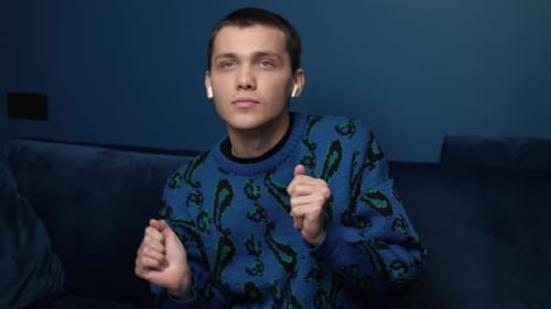 Man Listening to Music and Dancing Indoors