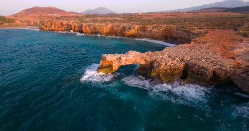 Coastal Cliffs and Ocean Waves Aerial View