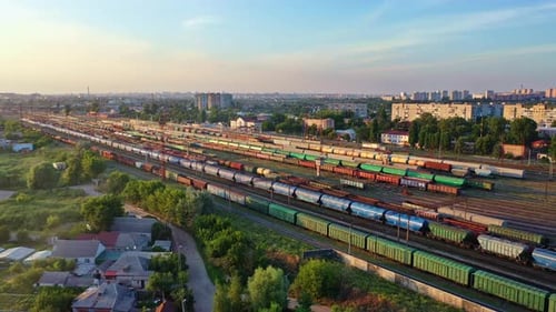 A Bird's-eye View of a Large Railway Station with Lots of Carriages