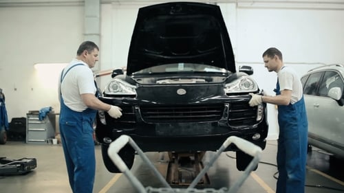 Men Put On The Bumper Bar.