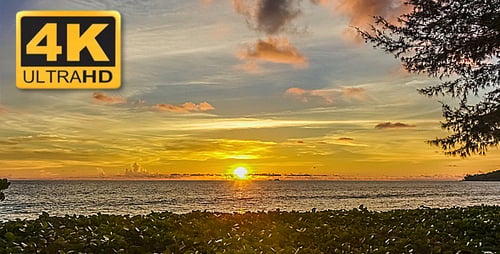 Sunset over Ocean with Colorful Sky and Clouds